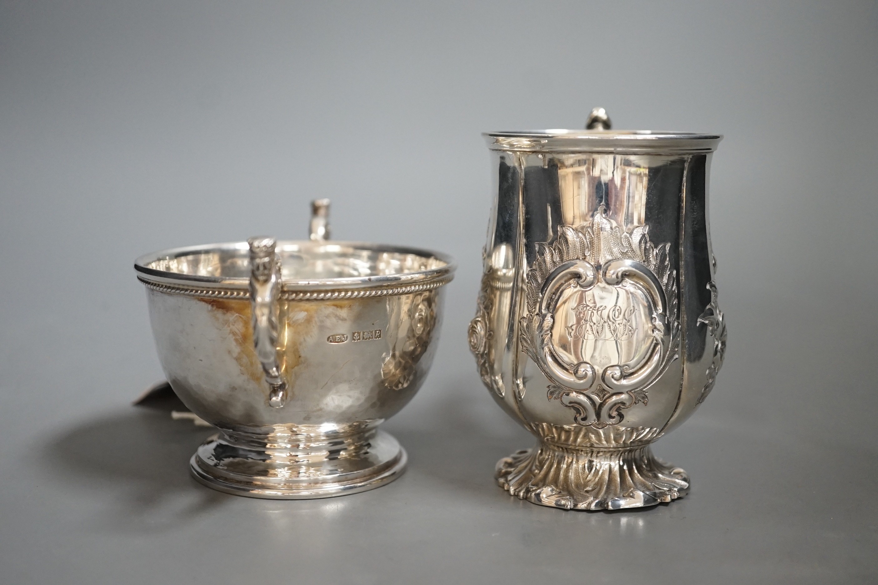 A Victorian embossed silver christening cup, Edward & John Barnard, London, 1848, 11cm and a modern small planished twin handled bowl by A.E. Jones Ltd.